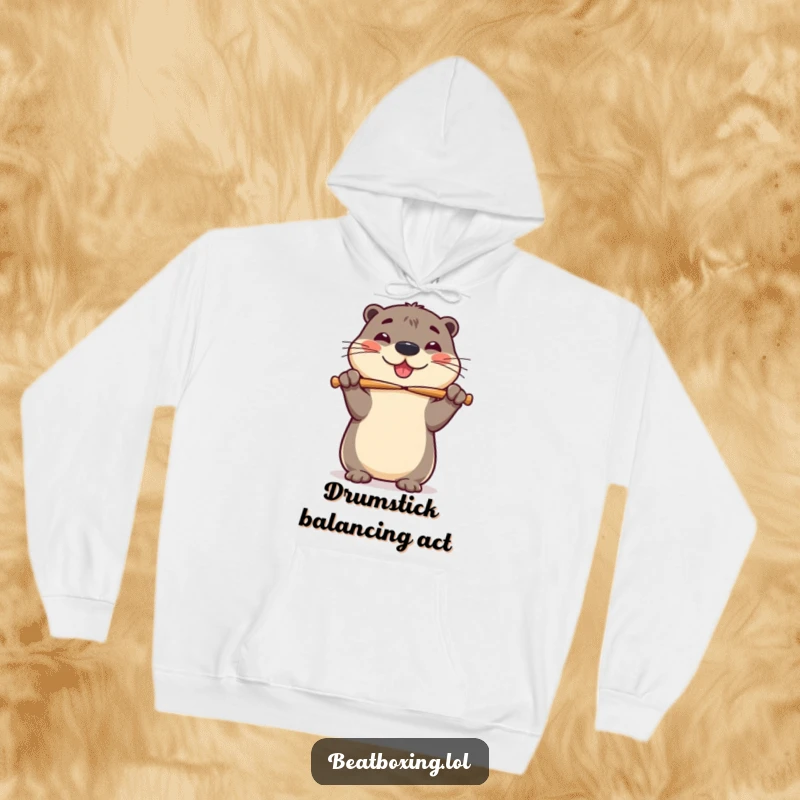 Funny hoodie featuring a cheerful otter attempting to balance drumsticks on its nose with infectious, wobbly glee.