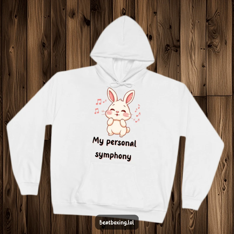 Funny Rabbit Hoodie: An energetic rabbit puffs its cheeks, releasing a delightful stream of musical notes, embodying vibrant sound.