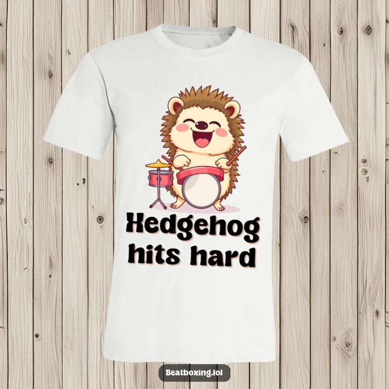 Funny t-shirt design of a laughing hedgehog balancing a tiny drum set, great for a funny music gift.